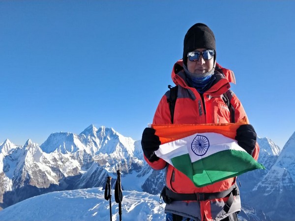 Umesh Zirpe unfurles the Tricolor at a height of 6,476 meters at Mount Mera on Friday. Photo/ANI