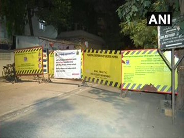 Posters declaring a locality, a containment zone was put up last night by BMC after a COVID-19 positive person was found near a government guest house in Mumbai.