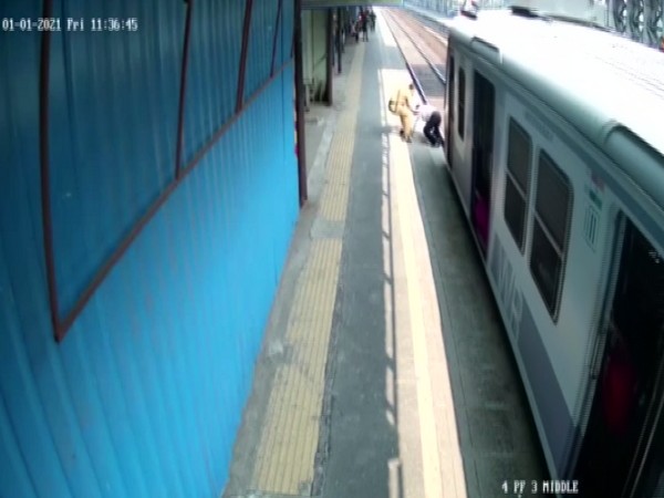 Mumbai police saves man from getting crushed by train (CCTV Footage).