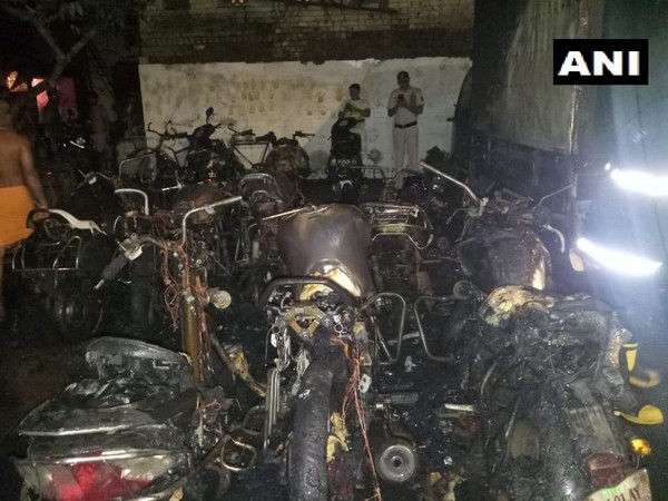 Motorcycles and four-wheelers gutted in Fire in Vijay Nagar area here on Thursday. Photo/ANI