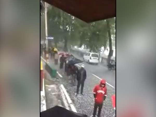 Liquor enthusiasts outside a store in Nainital on Tuesday. Photo/ANI