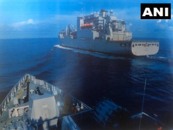 Indian Navy warship taking fuel supplies from US Navy warship near South China Sea.