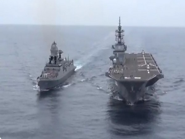 Indian Navy and Japanese Maritime Self-Defense Force (JMSDF) ships conducting operations in close formation at JIMEX-2020. 