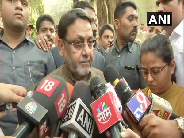 NCP leader Nawab Malik speaking to reporters in Mumbai on Saturday. 