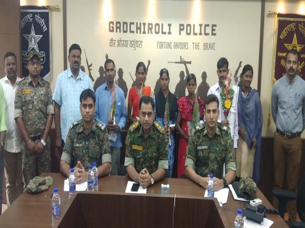 The surrendered naxals with the Gadchiroli police team on Tuesday (Photo/ANI)