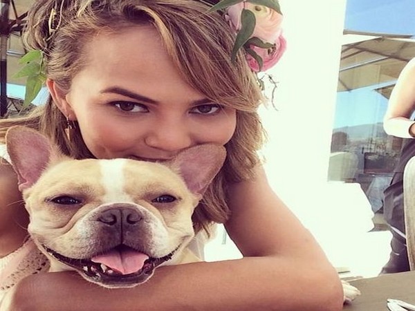 Chrissy Teigen with her dog Pippa (Image Source: Instagram)
