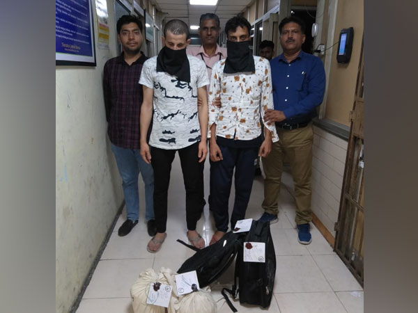 Two arrested drug smugglers in the custody of NCB officials in New Delhi on Monday. 