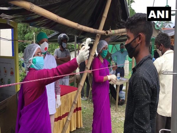 Health worker doing thermal screening of the people in Darjeeling on Saturday