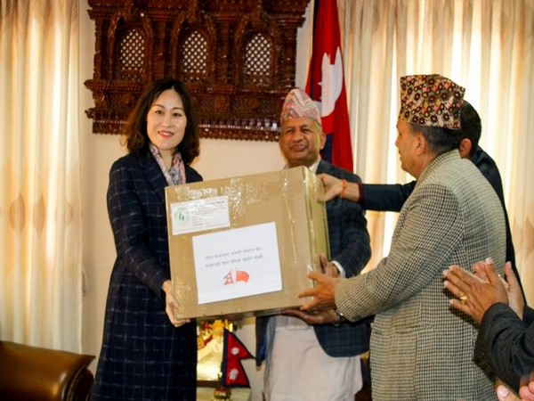 Nepali Foreign Affairs Minister Pradeep Kumar Gyawali donates masks to Chinese Ambassador Hou Yanqi in Kathmandu