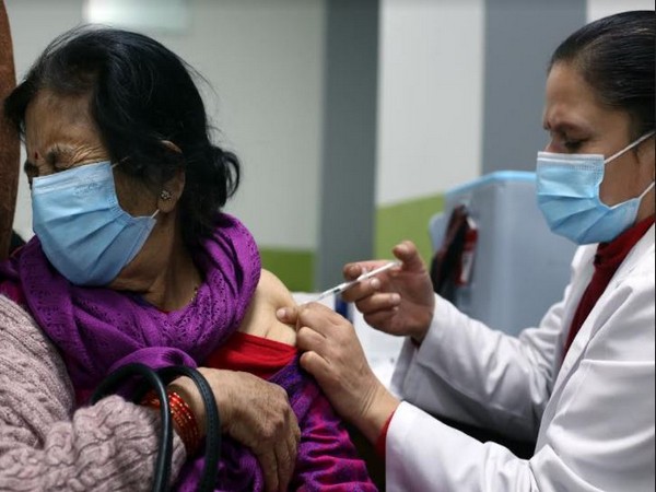People line up at vaccination centers as Nepal govt announce to make vaccination cards mandatory