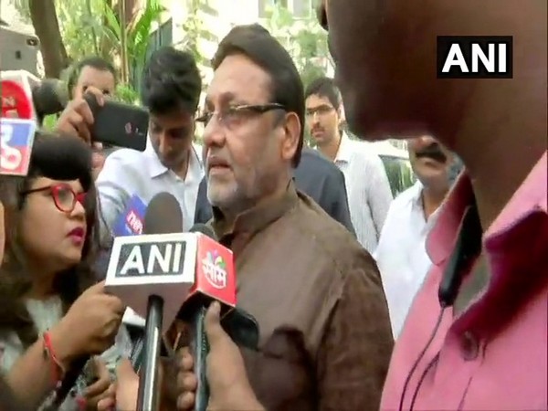 NCP leader Nawab Malik speaking to reporters in Mumbai on Saturday.