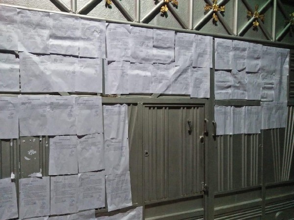 Court notices pasted outside SP MP Azam Khan's residence in Rampur, Uttar Pradesh on Monday.