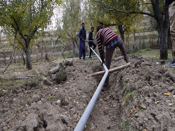 Installation of new water pipes in a village of Shopian district underway. (Photo/ANI)