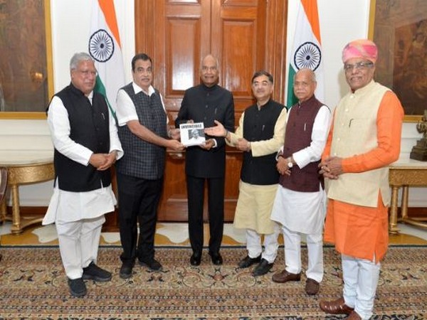 Union Minister Nitin Gadkari presenting a copy of the book 'Invincible - A Tribute to Manohar Parrikar' to President Ram Nath Kovind at Rashtrapati Bhawan on Tuesday. Photo/ ANI