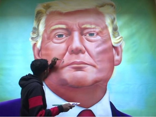 Artist Jagjot Singh painting a picture of USA President Donald J Trump on a canvas.