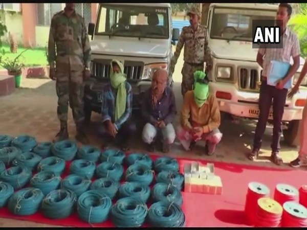 Cops with arrested Naxals on Monday. Photo/ANI