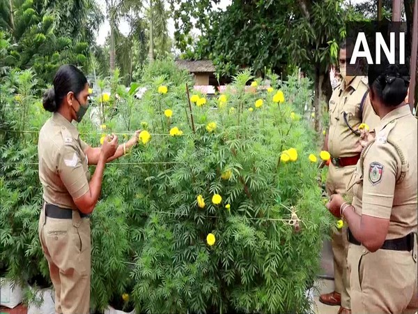 Police officers at garden in Mararikulam police station