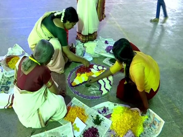 Participants making 'Athapookalam' on the occasion of Onam on Tuesday in Thiruvananthapuram. Photo/ANI