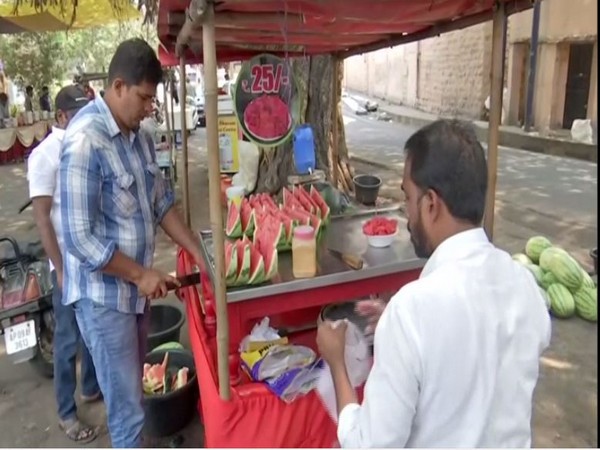 A customer purchasing watermelon in Hyderabad to beat scorching sun (Photo\ ANI)