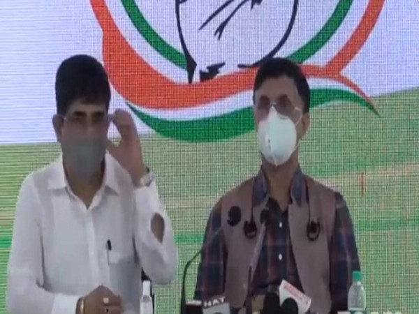Pawan Khera (R) addressing a press conference on Saturday. [Photo/ANI]