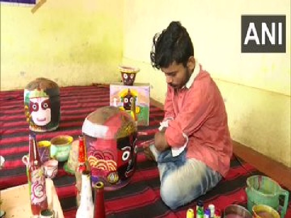 Visuals of Prabhakar Pradhan in Odisha who follows passion for painting after losing both hands in accident (Photo/ANI)