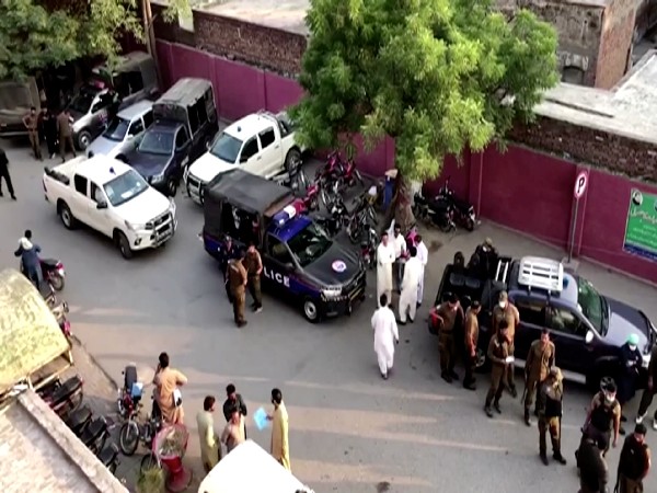 Police are seen on the street, after clashes between armed activists from a banned Islamist group in Sheikhupura, Pakistan, October 27. (Photo Credit: Reuters)