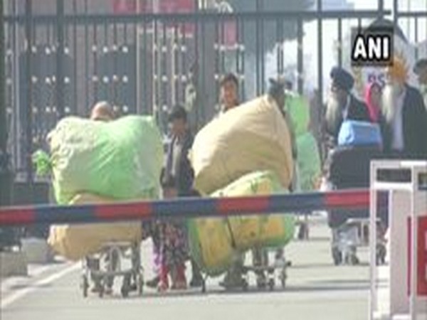 The Pakistani Hindu families crossing the border to enter India on Monday. Phot/ANI