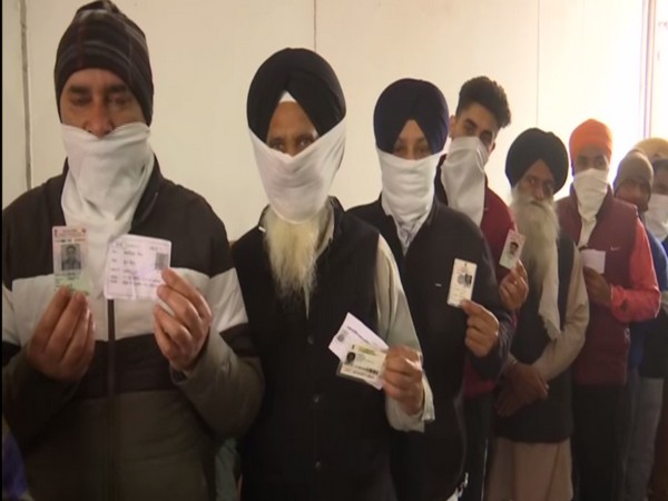 People standing in queue waiting for their turn to vote in Ward number 37 of Amritsar