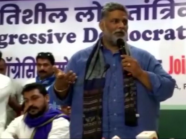 Chandrashekhar Azad Ravan (left, seated) and Pappu Yadav (right)