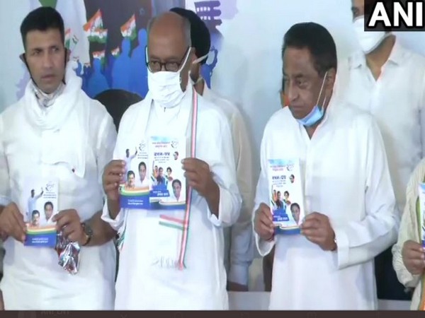 Congress leaders jeetu Patwari (Left), Digvijaya Singh (Centre) and Kamal Nath releasing party's manifesto for MP By-polls. (Photo/ANI)