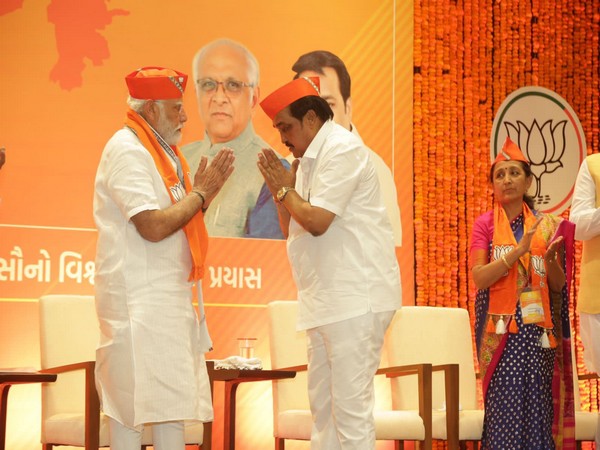 PM Narendra Modi donning the newly designed cap with state BJP president CR Paatil 