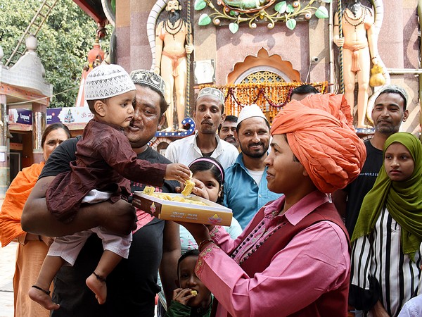 Mahant of Mankameshwar temple Devyagiri celebrates with Muslims after the Ayodhya verdict at Mankameshwar Temple in Lucknow on Saturday. ANI/Photo