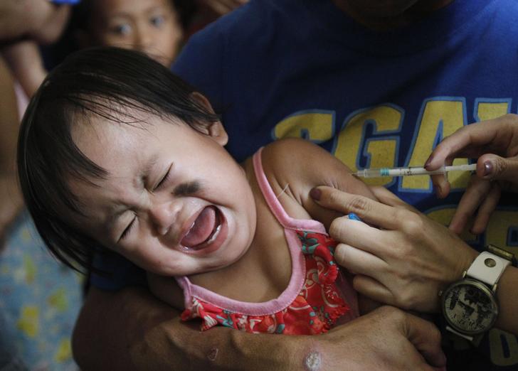 A child getting vaccinated against measles in Manila, Philippines in 2014.