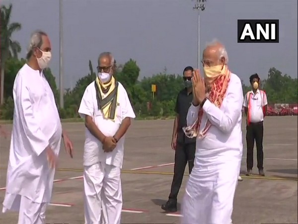 Prime Minister Narendra Modi received by Odisha CM Naveen Patnaik and Governor Ganeshi Lal at Bhubaneswar Airport.