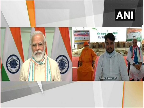 Prime Minister Narendra Modi interacting with people via video conferencing on Friday. [Photo/ANI]