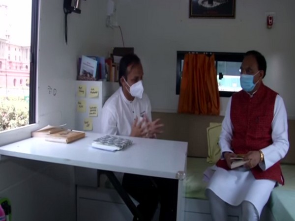 Ramesh Pokhriyal riding Energy Swaraj Yatra Bus (Photo/ ANI)