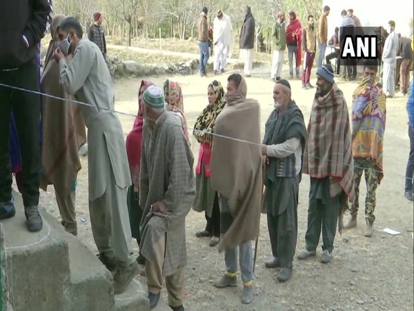 People queue up at their respective polling booths as voting for the fourth phase of District Development Council (DDC) elections is underway in the UT today.