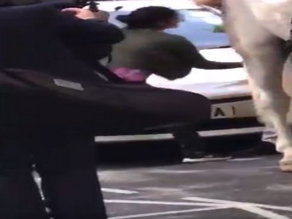 ANI journalist grabbing Indian flag from the hands of a Pakistani during protest outside Indian Embassy in London on Thursday.