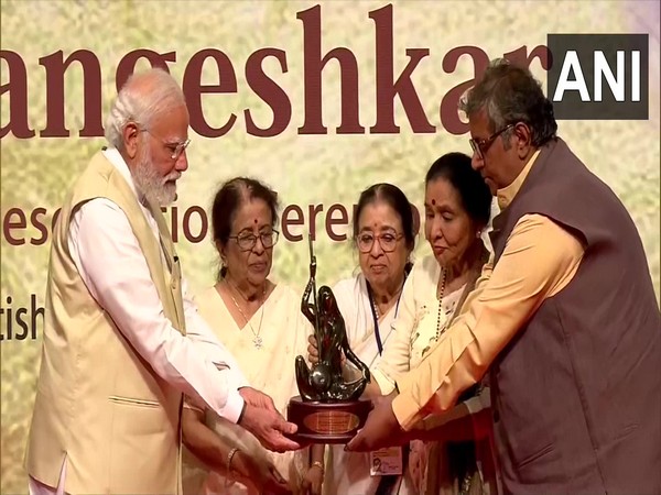 PM Narendra Modi receiving Lata Deenanath Mangeshkar Award in Mumbai. (ANI/photo)
