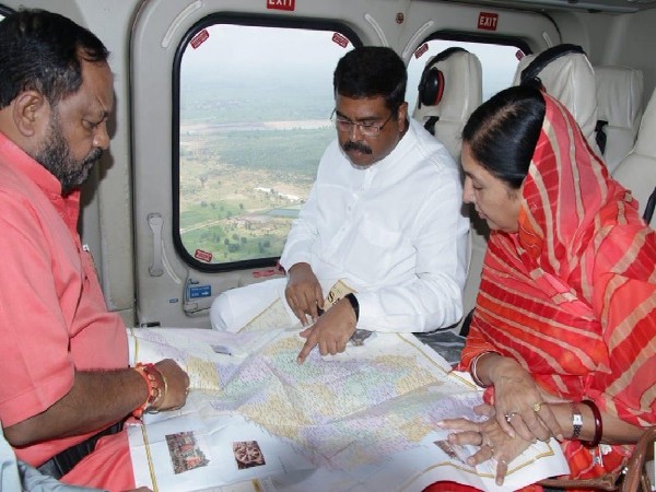Union Minister Dharmendra Pradhan conducting an aerial survey of flood situation in Odisha on August 17. Image Courtesy: Twitter 