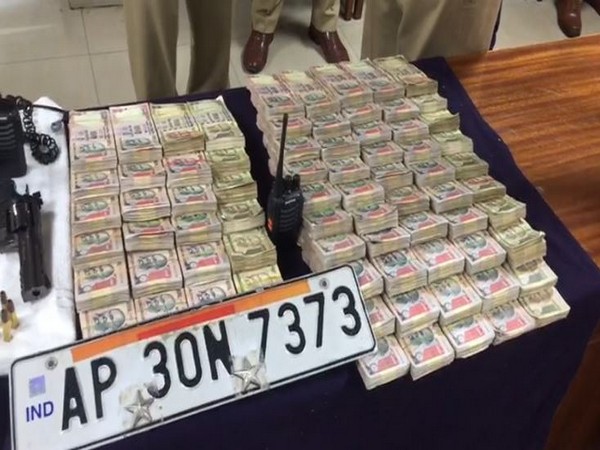 Fake police number plate and old currency recovered by police. Photo/ANI