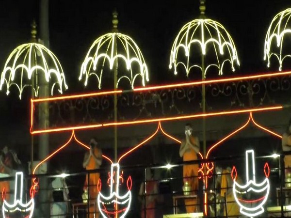 Priests at the Durga ghat offer prayers keeping COVID-19 guidelines in mind on Friday (Photo/ANI)