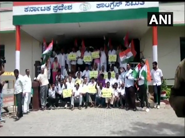 Congress workers during their protest outside KPCC office on Sunday in Bengaluru. (Photo: ANI)