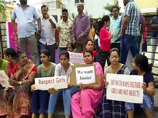 Residents of a Hyderabad colony where the veterinary doctor was living staged a protest against NHRC on Sunday. Photo/ANI
