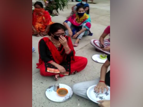 COVID-19 patients sitting on a protest in Pantnagar hostel and quarantine centre, Khatima [Photo/ANI]