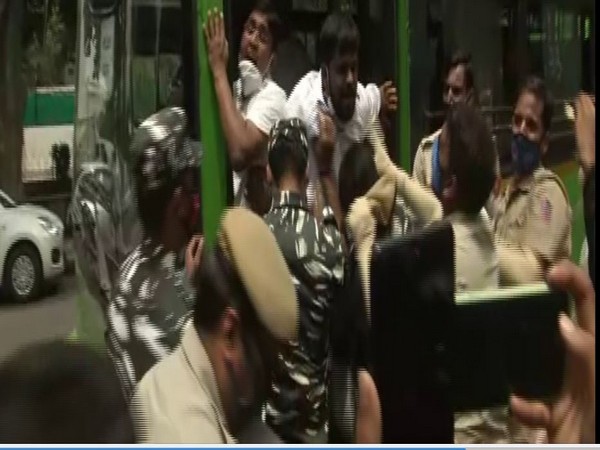 The police personnel were trying to clear the area and putting protestors inside a bus. (Photo: ANI)