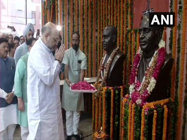 Amit Shah paid tributes to Pt Deen Dayal Upadhyaya and Syama Prasad Mukherjee at BJP Headquarter. (Photo/ANI)