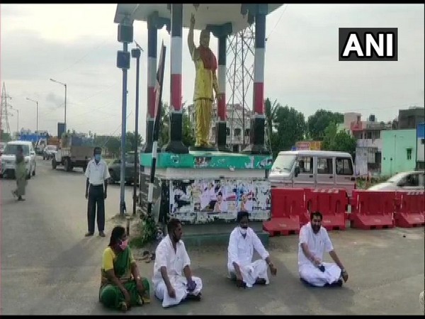 AIADMK MLAs sitting in front of MG Ramachandran statue in Villianur on Thursday. (Photo/ANI)
