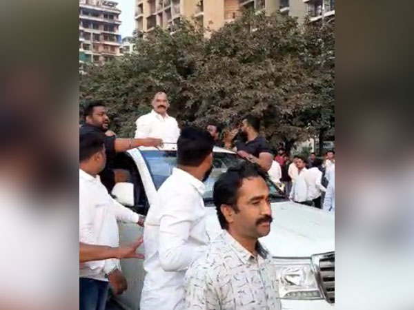 Gajanan Marne on top of the car. 