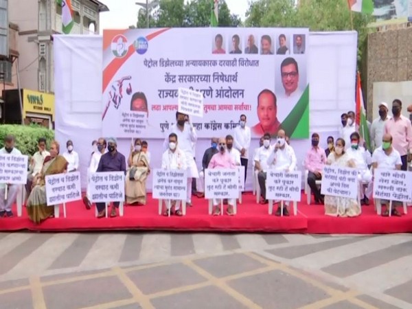 Congress leaders protest against fuel price hike in Pune. (Photo/ANI)